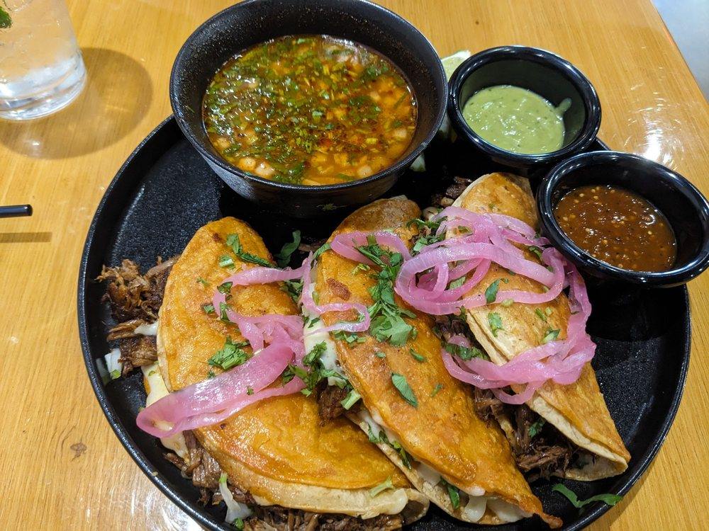Birria tacos with consommé and two house salsas